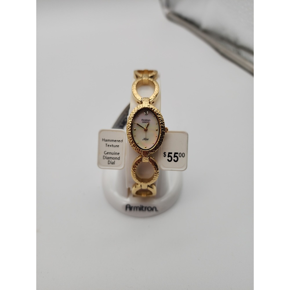 NWT Ladies Armitron Hammered Gold Tone watch genuine diamond dial